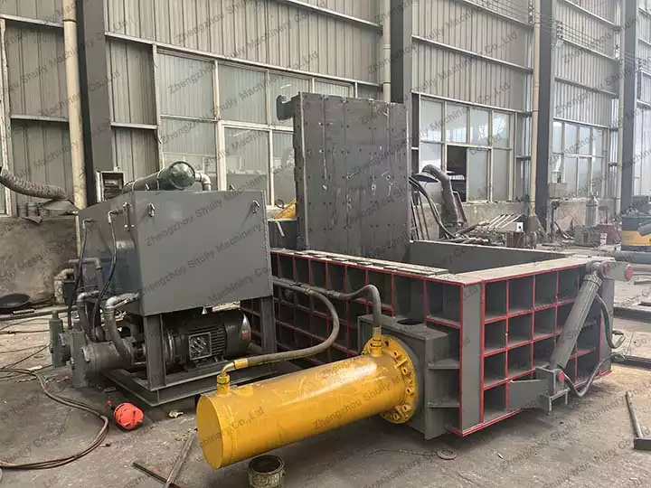 Scrap metal baling press